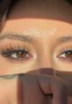 Close-up of captivating brown eyes with dramatic lashes, highlighting natural beauty and expression. Perfect for Athn inspiration.