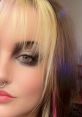 Close-up of a person with striking eye makeup and colorful hair, showcasing a bold fashion statement. Perfect for Jrdn style inspiration.