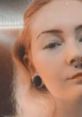 Portrait of a person with distinctive piercings, showcasing an alternative style and unique aesthetic expression.