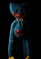 Nightmare Huggy Wuggy with menacing grin, eerie blue fur, and long limbs set against a dark background, evoking horror themes.
