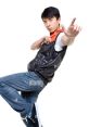Young dancer in stylish outfit striking a dynamic pose, showcasing movement and energy, perfect for dance or film themes.