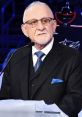 Jeff Rimer, broadcaster for the Columbus Blue Jackets, speaks at an event, showcasing his signature style and expertise.