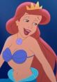 Happy mermaid with long red hair and a crown, embodying the spirit of Queen Athena in vibrant underwater colors.