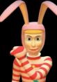 Popee the Performer character with pink bunny ears and striped outfit, showcasing a playful pose against a dark background.