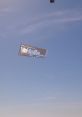 Banner flying in blue sky promoting YoHolla.com with the slogan "What Happens in YoHolla.com Stays in YoHolla.