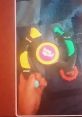 Hand interacting with the Bop It Extreme 2022 game, showcasing colorful buttons for exciting gameplay and challenges.