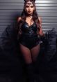 Skye Blue exudes confidence in a black corset and dramatic tulle, perfect for edgy fashion inspiration.