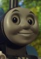 Close-up of Thomas the Tank Engine smiling, representing Benjamin Small's voice in "The Great Discovery" UK version.