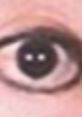 Close-up of an eye with distinct black pupil and light reflections, capturing the essence of Billie Jean (For) V2's visual style.