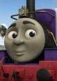 Charlie the playful purple engine, known for his cheerful personality and adventures, smiles against a bright blue sky.