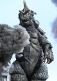 Gomess stands tall amidst smoke, showcasing its fierce expression and iconic scaly texture in an urban destruction scene.