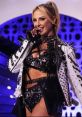 Harley Cameron performs in a stunning studded outfit, showcasing her edgy style and captivating stage presence.
