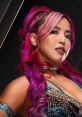 Mina Shirakawa, AEW wrestler, showcases vibrant pink hair and a fierce expression, embodying athleticism and style.
