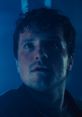 Mike After in a tense moment, showcasing emotion under dramatic blue lighting, highlighting his character's intensity.