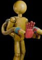 Stylized golden player figure with red robotic hand and flexible tubing, showcasing creativity in design and movement.