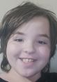 Cheerful child with tousled hair smiling brightly, perfect for promoting the "Narrator For Royce! Again! HELP" project.