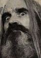 Otis Driftwood from House of 1000 Corpses displays an intense gaze, embodying horror film menace and dark charisma.