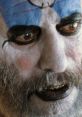 Close-up of Captain Spaulding showcasing dramatic makeup, fierce expression, and menacing gaze typical of horror characters.
