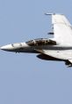 Boeing F-18 flying in clear blue sky, showcasing advanced design and agility in aerial maneuvers.