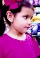 Young girl in pink shirt with bow, exploring colorful aisle, embodying the fun of Ellie Toys and Colors.