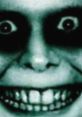 Eerie close-up of a face with exaggerated features, dark eyes, and an unsettling grin, perfect for horror themes.