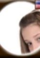 Close-up of a shy girl with long hair peeking, representing the Shy Girl (Voiceforge) character concept.