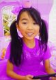 Lucy in vibrant pink and purple clothes, ready for colorful adventures in Season 1 of Toys And Colors Playdate.