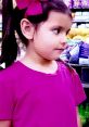 Young girl in a pink shirt with a bow, shopping in a grocery store, showcasing vibrant colors in "Toys And Colors Ellie".