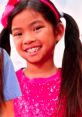 Smiling girl in a sparkly pink shirt, bringing joy to Toys And Colors Play Date Adventures Season 1 with vibrant energy.