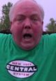 Rodney Kantorski expressing excitement while wearing a green New York Central System t-shirt outdoors.