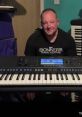 Musician seated by a keyboard, showcasing creativity inspired by the "Don't Star Song," ready to create music.