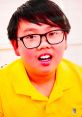 Young boy in a bright yellow shirt, smiling enthusiastically, showcasing a fun and colorful personality in Toys & Colors Vinnie.