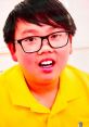Excited child in a yellow shirt engaging with colorful toys, perfect for Vinnie Toys and Colors YouTube content.
