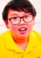 Young boy with glasses in a yellow shirt, engaging with Vinnie Toys and Colors 2020, showcasing fun and creativity.