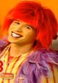 Moe Doodle from the DoodleBops, featuring vibrant red hair and colorful attire, brings joy and fun to children's entertainment.