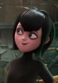 Mavis Dracula from Hotel Transylvania 4 with a playful expression, showcasing her signature black hair and stylish outfit.