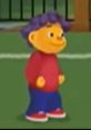 Sid the Science Kid stands smiling, wearing a red shirt and blue pants, ready for fun learning adventures.