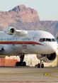 Honeywell RAAS V2 equipped aircraft on runway with mountainous backdrop, showcasing advanced aviation technology and safety features.