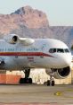 Honeywell RAAS V2-equipped aircraft taxiing on runway with mountains in the background, showcasing advanced aviation technology.