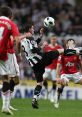 Player in black and white kit skillfully controls the ball during an intense Premier League match. Hull City FC focus.
