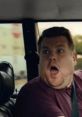 Surprised man in a car for a Confused.com advert, showcasing unexpected moments while driving, capturing attention.