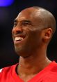 Kobe Bryant smiling, embodying the passion and joy of basketball, a favorite topic on the Ball Don't Lie Canada Podcast.
