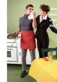 Vintage Schlitz advert featuring a man in a striped apron and a woman in a suit, playfully interacting in a kitchen setting.