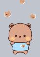 Cute cartoon bear character holding a shirt with adorable bear designs, set against a soft gray background.