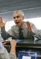 Frustrated man at a customer service desk expressing complaints and dissatisfaction about service issues.