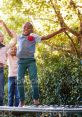 Kids joyfully jumping on a trampoline, surrounded by greenery, capturing the essence of fun and carefree childhood moments.