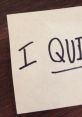 Handwritten note saying 'I QUIT' symbolizing the decision to quit a job or make a significant life change.