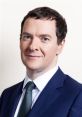 George Osborne in a formal suit, posing confidently with a neutral background, showcasing his professional demeanor.