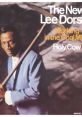 Lee Dorsey holding a scythe, promoting "The New Lee Dorsey: Working in the Coal Mine" album cover art.