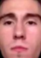 Close-up of a young man's face, featuring neutral expression and focused gaze, possibly related to Ditcher38 content.